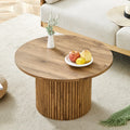 A Modern Circular coffee table with storage.